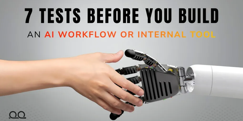 Human and robotic hands meeting beneath the title 7 Tests Before You Build an AI Workflow or Internal Tool.